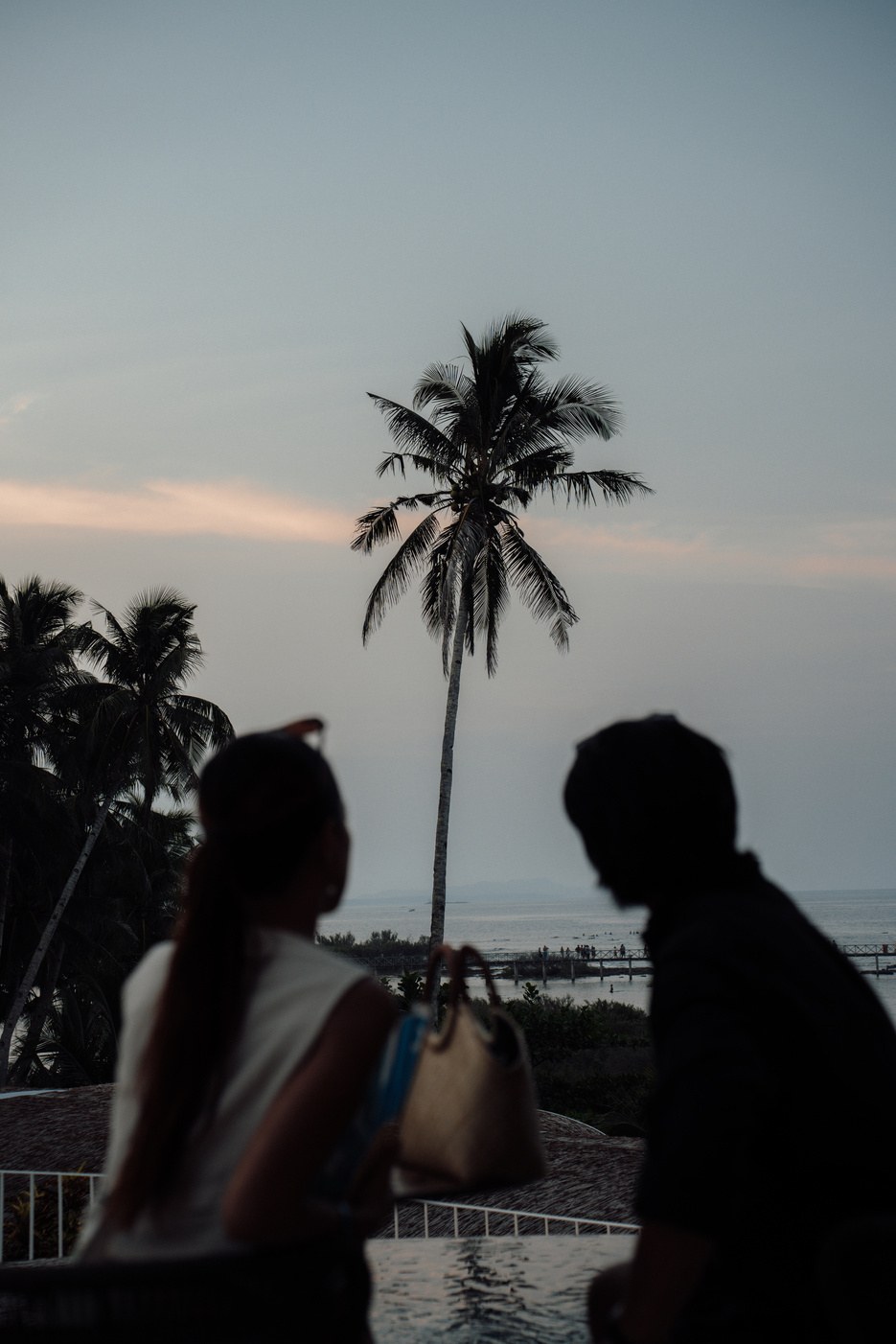 A couple watching the sunset at Burgos