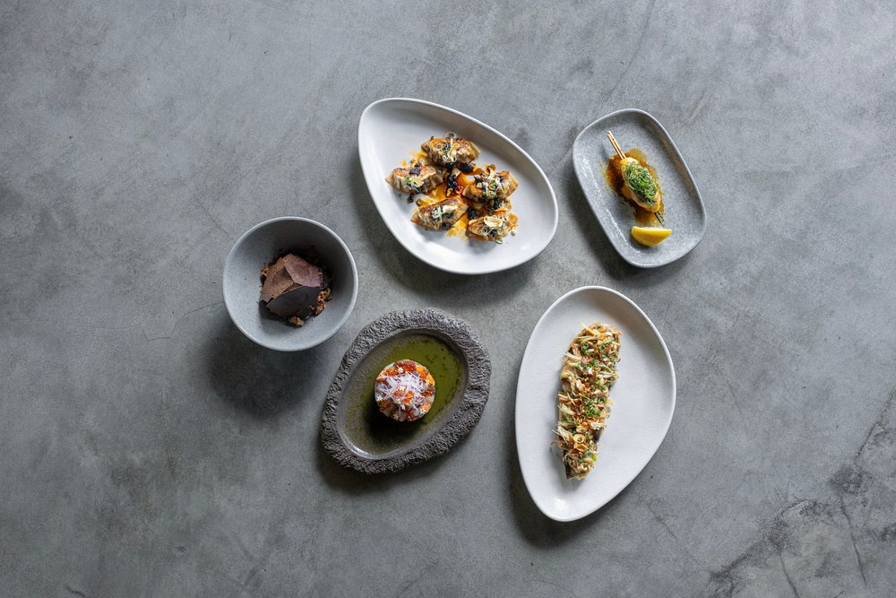 YUKI's plates laid out on stone