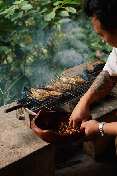 Fish grilling over an open fire at Burgos