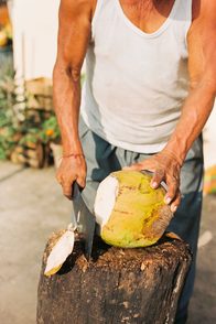 Opening a coconut by hand